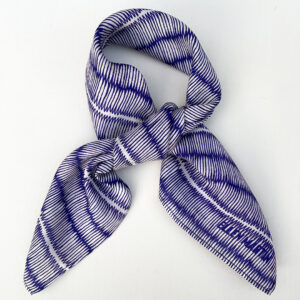 Small square silk scarf with intricate repeat pattern in blue and off-white.