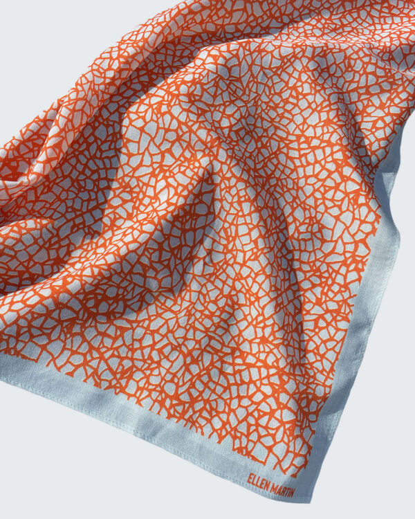 Frisa wool and silk blend scarf in orange and eggshell blue with a pattern inspired by broken china.