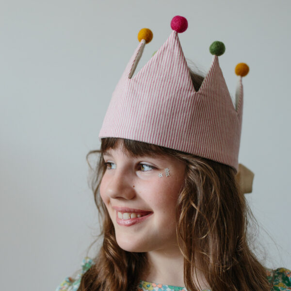 Gril in Pom Pom stripe circus crown