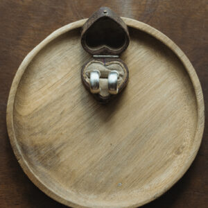 hoops displayed on a heart shaped vintage jewelelry box